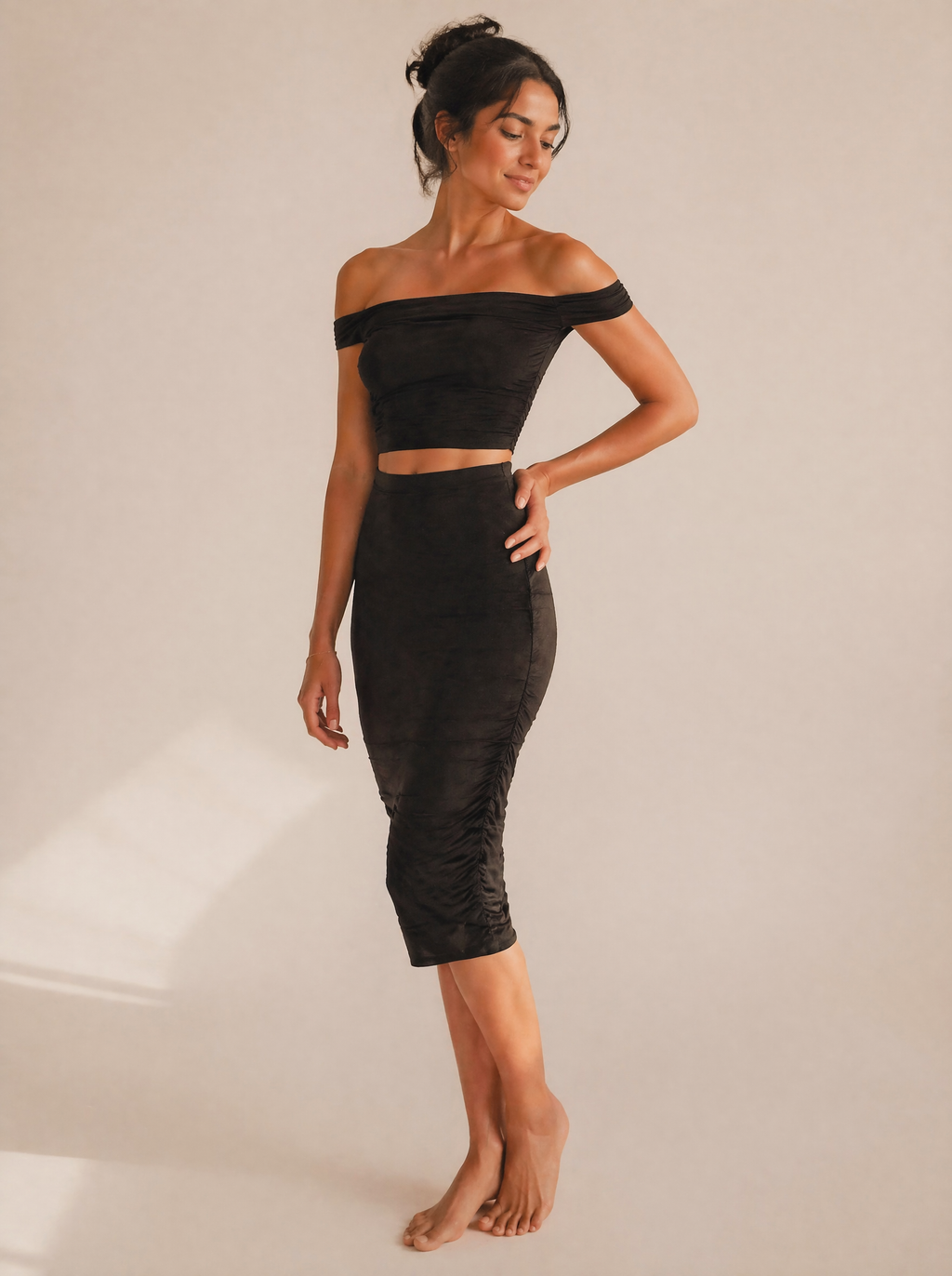 Off-Shoulder Ruched Crop Top & Midi Skirt Set in Black — 3/4 angle view