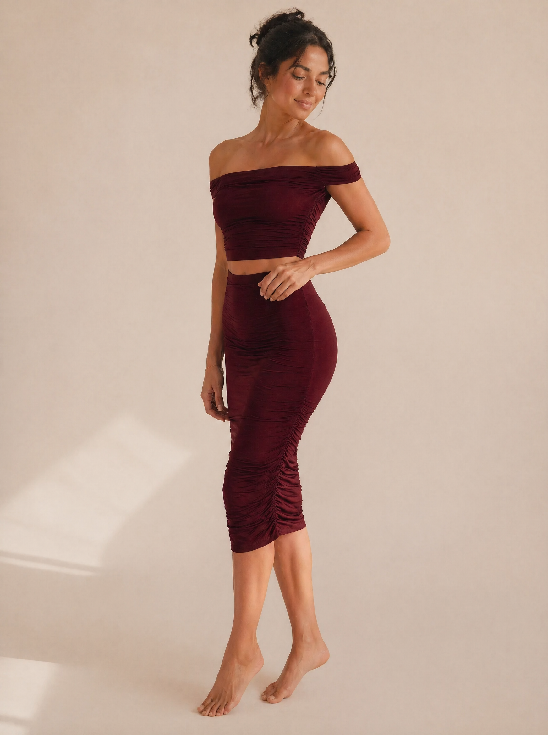 Off-Shoulder Ruched Crop Top & Midi Skirt Set in Burgundy — 3/4 angle view